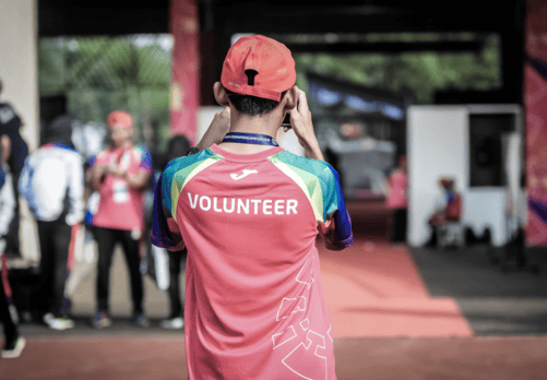 boy wearing "Volunteer" t-shirt