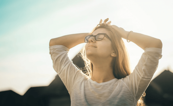 girl breathing and relaxing outside