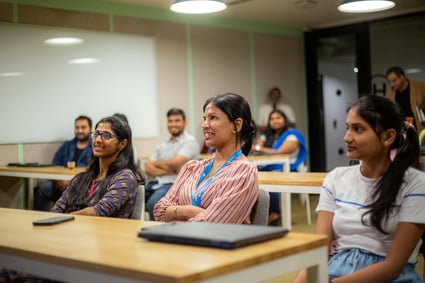 Early-career employees engaged in a training session, demonstrating the value of investing in junior staff development.
